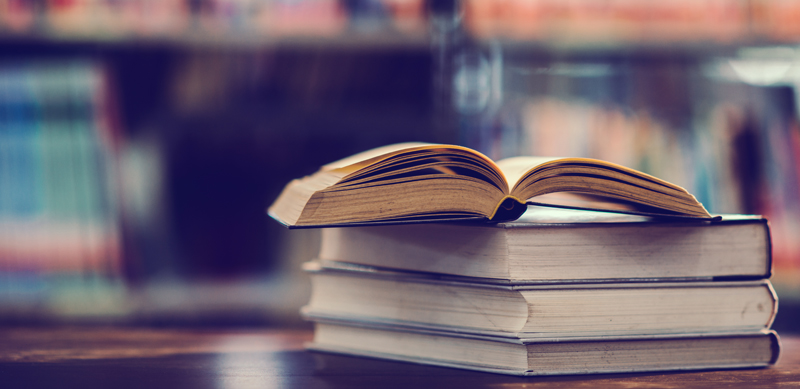 Book in library with open textbook,education learning concept Día del Profesor