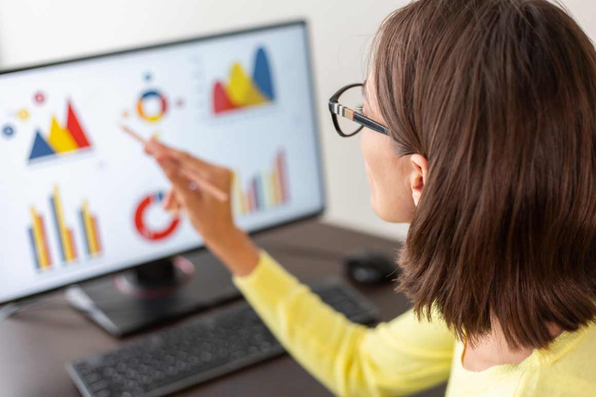 Caucasian advisor financial business analytics woman with data dashboard graphs RUVIX